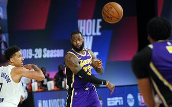 Orlando, FL - AUGUST 8: LeBron James #23 of the Los Angeles Lakers passes the ball during the game against the Indiana Pacers on August 8, 2020 at The Field House at ESPN Wide World Of Sports Complex in Orlando, Florida. NOTE TO USER: User expressly acknowledges and agrees that, by downloading and/or using this Photograph, user is consenting to the terms and conditions of the Getty Images License Agreement. Mandatory Copyright Notice: Copyright 2020 NBAE (Photo by Jesse D. Garrabrant/NBAE via Getty Images)