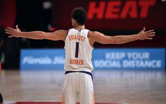 Orlando, FL - AUGUST 8: Devin Booker #1 of the Phoenix Suns looks on during the game against the Miami Heat on August 8, 2020 at Visa Athletic Center at ESPN Wide World of Sports in Orlando, Florida. NOTE TO USER: User expressly acknowledges and agrees that, by downloading and/or using this Photograph, user is consenting to the terms and conditions of the Getty Images License Agreement. Mandatory Copyright Notice: Copyright 2020 NBAE (Photo by David Dow/NBAE via Getty Images)