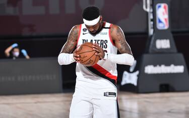 Orlando, FL - AUGUST 9: Carmelo Anthony #00 of the Portland Trail Blazers looks on prior to a game against the Philadelphia 76ers on August 9, 2020 at Visa Athletic Center at ESPN Wide World of Sports in Orlando, Florida. NOTE TO USER: User expressly acknowledges and agrees that, by downloading and/or using this Photograph, user is consenting to the terms and conditions of the Getty Images License Agreement. Mandatory Copyright Notice: Copyright 2020 NBAE (Photo by Jesse D. Garrabrant/NBAE via Getty Images)
