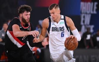 Orlando, FL - AUGUST 11: Kristaps Porzingis #6 of the Dallas Mavericks drives to the basket against the Portland Trail Blazers on August 11, 2020 at The Field House in Orlando, Florida. NOTE TO USER: User expressly acknowledges and agrees that, by downloading and/or using this Photograph, user is consenting to the terms and conditions of the Getty Images License Agreement. Mandatory Copyright Notice: Copyright 2020 NBAE (Photo by Garrett Ellwood/NBAE via Getty Images)
