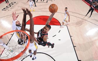PORTLAND, OR - JANUARY 20: Damian Lillard #0 of the Portland Trail Blazers drives to the basket during the game against the Golden State Warriors on January 20   , 2020 at the Moda Center Arena in Portland, Oregon. NOTE TO USER: User expressly acknowledges and agrees that, by downloading and or using this photograph, user is consenting to the terms and conditions of the Getty Images License Agreement. Mandatory Copyright Notice: Copyright 2020 NBAE (Photo by Sam Forencich/NBAE via Getty Images)