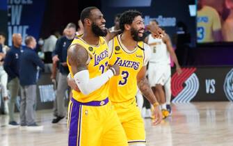 Orlando, FL - AUGUST 10: LeBron James #23 of the Los Angeles Lakers and Anthony Davis #3 of the Los Angeles Lakers smile after a win against the Denver Nuggets on August 10, 2020 at the AdventHealth Arena at in Orlando, Florida. NOTE TO USER: User expressly acknowledges and agrees that, by downloading and/or using this Photograph, user is consenting to the terms and conditions of the Getty Images License Agreement. Mandatory Copyright Notice: Copyright 2020 NBAE (Photo by Jesse D. Garrabrant/NBAE via Getty Images)
