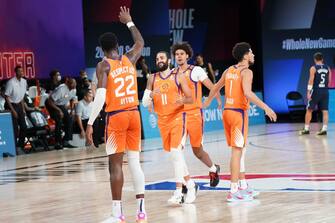 ORLANDO, FL - AUGUST 13: Deandre Ayton #22 high-fives Ricky Rubio #11 of the Phoenix Suns during the game on August 13, 2020 at AdventHealth Arena in Orlando, Florida. NOTE TO USER: User expressly acknowledges and agrees that, by downloading and/or using this Photograph, user is consenting to the terms and conditions of the Getty Images License Agreement. Mandatory Copyright Notice: Copyright 2020 NBAE (Photo by Jesse D. Garrabrant/NBAE via Getty Images)
