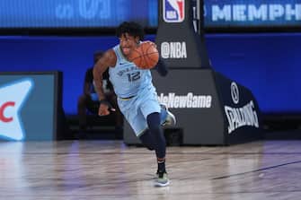 Orlando, FL - AUGUST 13: Ja Morant #12 of the Memphis Grizzlies handles the ball during the game against the Milwaukee Bucks on August 13, 2020 at The Visa Athletic Center at ESPN Wide World Of Sports Complex in Reunion, Florida. NOTE TO USER: User expressly acknowledges and agrees that, by downloading and/or using this Photograph, user is consenting to the terms and conditions of the Getty Images License Agreement. Mandatory Copyright Notice: Copyright 2020 NBAE (Photo by Joe Murphy/NBAE via Getty Images)