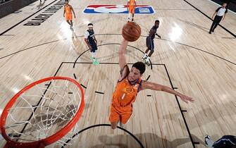 Orlando, FL - AUGUST 13: Devin Booker #1 of the Phoenix Suns dunks the ball against the Dallas Mavericks on August 13, 2020 at AdventHealth Arena in Orlando, Florida. NOTE TO USER: User expressly acknowledges and agrees that, by downloading and/or using this Photograph, user is consenting to the terms and conditions of the Getty Images License Agreement. Mandatory Copyright Notice: Copyright 2020 NBAE (Photo by David Sherman/NBAE via Getty Images)
