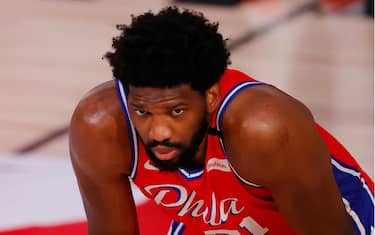 LAKE BUENA VISTA, FLORIDA - AUGUST 09: Joel Embiid #21 of the Philadelphia 76ers looks on  against the Portland Trail Blazersat Visa Athletic Center at ESPN Wide World Of Sports Complex on August 09, 2020 in Lake Buena Vista, Florida. NOTE TO USER: User expressly acknowledges and agrees that, by downloading and or using this photograph, User is consenting to the terms and conditions of the Getty Images License Agreement. (Photo by Kevin C. Cox/Getty Images)