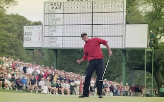 Tiger Woods of the United States celebrates after sinking a 4 feet putt to win the US Masters Golf Tournament with a record low score of 18 under par 13 April 1997 at the Augusta National Golf Club in Augusta, Georgia, United States. (Photo by Stephen Munday/Allsport/Getty Images)