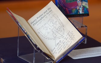 Hand-written notes by author J.K. Rowling are pictured inside a rare first edition of her book 'Harry Potter and the Philosopher's Stone'm displayed at The National Library of Scotland in Edinburgh, Scotland on June 26, 2017.
Harry Potter turns 20 on Monday when muggle readers in gowns and glasses from Indonesia to Uruguay will celebrate the birth of a global publishing phenomenon in 1997. Conjured up on a 1990 train journey between Manchester and London, the saga follows a young wizard named Harry Potter and his friends Ron Weasley and Hermione Granger at the Hogwarts School of Witchcraft and Wizardry, led by headmaster Albus Dumbledore. / AFP PHOTO / NEIL HANNA        (Photo credit should read NEIL HANNA/AFP via Getty Images)