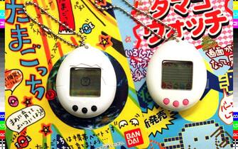 Picture shows Bandai's electronic virtual pet "Tamagotchi" (L) and a fake "Tamago Watch" which was seized by police in Osaka 29 May. Police raided a company that allegedly sold imitations of an egg-shaped electronic toy Tamagotchi that has taken Japan by storm since its debut last year.       AFP PHOTO (Photo by JIJI PRESS / AFP) / Japan OUT        (Photo credit should read JIJI PRESS/AFP via Getty Images)