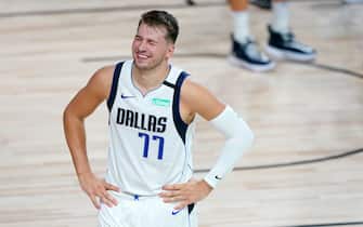 LAKE BUENA VISTA, FLORIDA - AUGUST 19:  Luka Doncic #77 of the Dallas Mavericks reacts to a foul call during action against the LA Clippers in the second half in game two of the first round of the NBA playoffs at AdventHealth Arena at ESPN Wide World Of Sports Complex on August 19, 2020 in Lake Buena Vista, Florida. NOTE TO USER: User expressly acknowledges and agrees that, by downloading and or using this photograph, User is consenting to the terms and conditions of the Getty Images License Agreement.  (Photo by Ashley Landis-Pool/Getty Images)