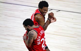 Aug 21, 2020; Lake Buena Vista, Florida, USA; Toronto Raptors guard Fred VanVleet (23) celebrates with guard Kyle Lowry (7) after making a half court shot against the Brooklyn Nets to end the first half in game three of the first round of the 2020 NBA Playoffs at The Field House. Mandatory Credit: Kim Klement-USA TODAY Sports