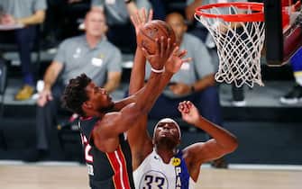 Aug 22, 2020; Lake Buena Vista, Florida, USA; Indiana Pacers center Myles Turner (33) blocks the shot of Miami Heat forward Jimmy Butler (22) during the first half of Game 3 of an NBA basketball first-round playoff series at AdventHealth Arena. Mandatory Credit: Kim Klement-USA TODAY Sports