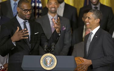 US President Barack Obama (R) poses with LeBron James as he welcomes the NBA Champion Miami Heat to the White House to honor the team and their 2012 NBA Championship victory  at the White House in Washington, DC, January 28, 2013.               AFP PHOTO/Jim WATSON        (Photo credit should read JIM WATSON/AFP via Getty Images)