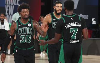 ORLANDO, FL - AUGUST 30: Marcus Smart #36 high-fives Jaylen Brown #7 of the Boston Celtics during Game One of the Eastern Conference SemiFinals of the NBA Playoffs on August 30, 2020 at The Field House in Orlando, Florida. NOTE TO USER: User expressly acknowledges and agrees that, by downloading and/or using this Photograph, user is consenting to the terms and conditions of the Getty Images License Agreement. Mandatory Copyright Notice: Copyright 2020 NBAE (Photo by Nathaniel S. Butler/NBAE via Getty Images)