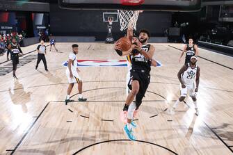 Orlando, FL - AUGUST 19: Jamal Murray #27 of the Denver Nuggets drives to the basket against the Utah Jazz during Round One, Game Two of the NBA Playoffs on August 19, 2020 at The AdventHealth Arena in Orlando, Florida. NOTE TO USER: User expressly acknowledges and agrees that, by downloading and/or using this Photograph, user is consenting to the terms and conditions of the Getty Images License Agreement. Mandatory Copyright Notice: Copyright 2020 NBAE (Photo by Joe Murphy/NBAE via Getty Images)
