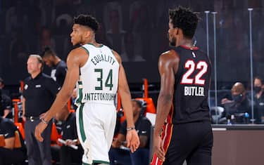 ORLANDO, FL - AUGUST 31: Giannis Antetokounmpo #34 of the Milwaukee Bucks and Jimmy Butler #22 of the Miami Heat look on during Game One of the Eastern Conference Semifinals of the NBA Playoffs on August 31, 2020 at the The Field House at ESPN Wide World Of Sports Complex in Orlando, Florida. NOTE TO USER: User expressly acknowledges and agrees that, by downloading and/or using this Photograph, user is consenting to the terms and conditions of the Getty Images License Agreement. Mandatory Copyright Notice: Copyright 2020 NBAE (Photo by Jesse D. Garrabrant/NBAE via Getty Images)