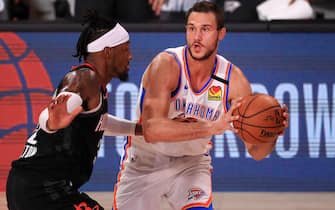 LAKE BUENA VISTA, FLORIDA - SEPTEMBER 02: Danilo Gallinari #8 of the Oklahoma City Thunder drives the ball against Robert Covington #33 of the Houston Rockets during the second quarter in Game Seven of the Western Conference First Round during the 2020 NBA Playoffs at AdventHealth Arena at ESPN Wide World Of Sports Complex on September 02, 2020 in Lake Buena Vista, Florida. NOTE TO USER: User expressly acknowledges and agrees that, by downloading and or using this photograph, User is consenting to the terms and conditions of the Getty Images License Agreement. (Photo by Mike Ehrmann/Getty Images)