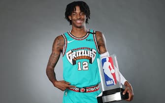 EADS, TN - SEPTEMBER 3:  Ja Morant #12 of the Memphis Grizzlies holds the Eddie Gottlieb Trophy for a portrait after being named the 2019-20 Kia NBA Rookie of the Year on September 3, 2020 in Eads, Tennessee. NOTE TO USER: User expressly acknowledges and agrees that, by downloading and/or using this photograph, user is consenting to the terms and conditions of the Getty Images License Agreement. Mandatory Copyright Notice: Copyright 2020 NBAE (Photo by Joe Murphy/NBAE via Getty Images)