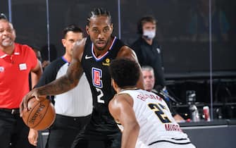 ORLANDO, FL - SEPTEMBER 3: Kawhi Leonard #2 of the LA Clippers handles the ball against the Denver Nuggets during Game One of the Western Conference SemiFinals of the NBA Playoffs on September 3, 2020 at AdventHealth Arena in Orlando, Florida. NOTE TO USER: User expressly acknowledges and agrees that, by downloading and/or using this Photograph, user is consenting to the terms and conditions of the Getty Images License Agreement. Mandatory Copyright Notice: Copyright 2020 NBAE (Photo by Andrew D. Bernstein/NBAE via Getty Images)