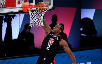 LAKE BUENA VISTA, FLORIDA - SEPTEMBER 03: Kawhi Leonard #2 of the LA Clippers dunks the ball during the second quarter against the Denver Nuggets in Game One of the Western Conference Second Round during the 2020 NBA Playoffs at AdventHealth Arena at the ESPN Wide World Of Sports Complex on September 03, 2020 in Lake Buena Vista, Florida. NOTE TO USER: User expressly acknowledges and agrees that, by downloading and or using this photograph, User is consenting to the terms and conditions of the Getty Images License Agreement. (Photo by Douglas P. DeFelice/Getty Images)