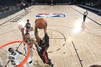 Orlando, FL - SEPTEMBER 4: Bam Adebayo #13 of the Miami Heat shoots the ball against the Milwaukee Bucks during Game Three of the Eastern Conference Semifinals on September 4, 2020 in Orlando, Florida at The Field House. NOTE TO USER: User expressly acknowledges and agrees that, by downloading and/or using this Photograph, user is consenting to the terms and conditions of the Getty Images License Agreement. Mandatory Copyright Notice: Copyright 2020 NBAE (Photo by Nathaniel S. Butler/NBAE via Getty Images)