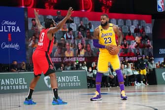 ORLANDO, FL - SEPTEMBER 10: LeBron James #23 of the Los Angeles Lakers handles the ball against James Harden #13 of the Houston Rockets during Game Four of the Western Conference Semifinals on September 10, 2020 at the AdventHealth Arena at ESPN Wide World Of Sports Complex in Orlando, Florida. NOTE TO USER: User expressly acknowledges and agrees that, by downloading and/or using this Photograph, user is consenting to the terms and conditions of the Getty Images License Agreement. Mandatory Copyright Notice: Copyright 2020 NBAE (Photo by Jesse D. Garrabrant/NBAE via Getty Images)