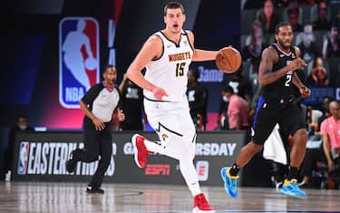 ORLANDO, FL - SEPTEMBER 15: Nikola Jokic #15 of the Denver Nuggets dribbles the ball up court against the LA Clippers during Game Seven of the Western Conference Semifinals of the NBA Playoffs on September 15, 2020 in Orlando, Florida at AdventHealth Arena. NOTE TO USER: User expressly acknowledges and agrees that, by downloading and/or using this photograph, user is consenting to the terms and conditions of the Getty Images License Agreement. Mandatory Copyright Notice: Copyright 2020 NBAE (Photo by Garrett Ellwood/NBAE via Getty Images)
