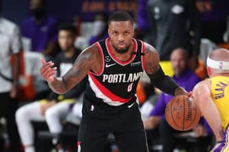 Orlando, FL - AUGUST 18: Damian Lillard #0 of the Portland Trail Blazers handles the ball against the Los Angeles Lakers during Round One, Game One of the NBA Playoffs on August 18, 2020 in Orlando, Florida at The Field House. NOTE TO USER: User expressly acknowledges and agrees that, by downloading and/or using this Photograph, user is consenting to the terms and conditions of the Getty Images License Agreement. Mandatory Copyright Notice: Copyright 2020 NBAE (Photo by Joe Murphy/NBAE via Getty Images)