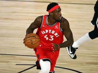 LAKE BUENA VISTA, FLORIDA - AUGUST 23:  Pascal Siakam #43 of the Toronto Raptors moves the ball against the Brooklyn Nets during the first half in game four of the first round of the NBA playoffs at The Field House at ESPN Wide World Of Sports Complex on August 23, 2020 in Lake Buena Vista, Florida. NOTE TO USER: User expressly acknowledges and agrees that, by downloading and or using this photograph, User is consenting to the terms and conditions of the Getty Images License Agreement.  (Photo by Kim Klement-Pool/Getty Images)