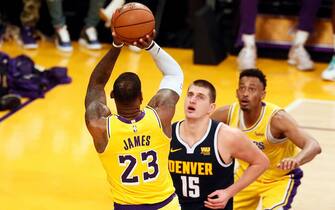 LOS ANGELES, CA - OCTOBER 25: LeBron James #23 of the Los Angeles Lakers shoots the ball over Nikola Jokic #15 of the Denver Nuggets during a game on October 25, 2018 at the Staples Center in Los Angeles, California. NOTE TO USER: User expressly acknowledges and agrees that, by downloading and/or using this photograph, User is consenting to the terms and conditions of the Getty Images License Agreement. Mandatory Copyright Notice: Copyright 2018 NBAE (Photo by Chris Elise/NBAE via Getty Images)