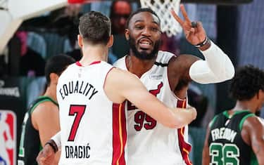 ORLANDO, FL - SEPTEMBER 17: Goran Dragic #7 of the Miami Heat and Jae Crowder #99 of the Miami Heat hug during a game against the Boston Celtics during Game Two of the Eastern Conference Finals of the NBA Playoffs on September 17, 2020 at the AdventHealth Arena at ESPN Wide World Of Sports Complex in Orlando, Florida. NOTE TO USER: User expressly acknowledges and agrees that, by downloading and/or using this Photograph, user is consenting to the terms and conditions of the Getty Images License Agreement. Mandatory Copyright Notice: Copyright 2020 NBAE (Photo by Jesse D. Garrabrant/NBAE via Getty Images)