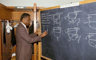 BOSTON - 1987:  Head coach K.C. Jones of the Boston Celtics draws up plays on the blackboard prior to a NBA game at the Boston Garden in 1987 in Boston, Massachusetts.  NOTE TO USER:  User expressly acknowledges and agrees that, by downloading and/or using this Photograph, user is consenting to the terms and conditions of the Getty Images License Agreement.  Mandatory Copyright Notice: Copyright 1987 NBAE (Photo by Andrew D. Bernstein/NBAE via Getty Images) *** Local Caption *** K.C. Jones 
