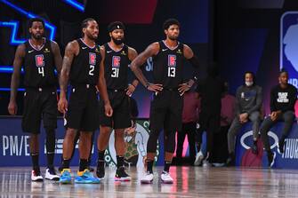 ORLANDO, FL - SEPTEMBER 15: The LA Clippers stand on the court during Game Seven of the Western Conference Semifinals of the NBA Playoffs against the Denver Nuggets on September 15, 2020 in Orlando, Florida at AdventHealth Arena. NOTE TO USER: User expressly acknowledges and agrees that, by downloading and/or using this photograph, user is consenting to the terms and conditions of the Getty Images License Agreement. Mandatory Copyright Notice: Copyright 2020 NBAE (Photo by Garrett Ellwood/NBAE via Getty Images)