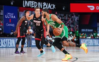 ORLANDO, FL - SEPTEMBER 19: Jayson Tatum #0 of the Boston Celtics handles the ball against Duncan Robinson #55 of the Miami Heat during Game Two of the Eastern Conference Finals of the NBA Playoffs on September 19, 2020 at the AdventHealth Arena at ESPN Wide World Of Sports Complex in Orlando, Florida. NOTE TO USER: User expressly acknowledges and agrees that, by downloading and/or using this Photograph, user is consenting to the terms and conditions of the Getty Images License Agreement. Mandatory Copyright Notice: Copyright 2020 NBAE (Photo by Jesse D. Garrabrant/NBAE via Getty Images)