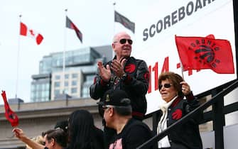 1150397060 TORONTO, ON - JUNE 17: Larry Tanenbaum, chairman of MLSE, owners of the Toronto Raptors, waves to the crowd during the Toronto Raptors Victory Parade on June 17, 2019 in Toronto, Canada. The Toronto Raptors beat the Golden State Warriors 4-2 to win the 2019 NBA Finals. NOTE TO USER: User expressly acknowledges and agrees that, by downloading and or using this photograph, User is consenting to the terms and conditions of the Getty Images License Agreement. (Photo by Vaughn Ridley/Getty Images)