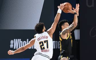ORLANDO, FL - SEPTEMBER 20: Jamal Murray #27 of the Denver Nuggets blocks shot by Danny Green #14 of the Los Angeles Lakers during Game Two of the Western Conference Finals of the NBA Playoffs on September 20, 2020 at AdventHealth Arena in Orlando, Florida. NOTE TO USER: User expressly acknowledges and agrees that, by downloading and/or using this Photograph, user is consenting to the terms and conditions of the Getty Images License Agreement. Mandatory Copyright Notice: Copyright 2020 NBAE (Photo by Andrew D. Bernstein/NBAE via Getty Images)