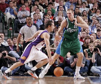 DALLAS - MARCH 14:  Steve Nash #13 of the Phoenix Suns drives the ball against Dirk Nowitzki #41 of the Dallas Mavericks on March 14, 2007 at the American Airlines Center in Dallas, Texas.  NOTE TO USER: User expressly acknowledges and agrees that, by downloading and/or using this Photograph, user is consenting to the terms and conditions of the Getty Images License Agreement. Mandatory Copyright Notice: Copyright 2007 NBAE  (Photo by Tim Heitman/NBAE via Getty Images)