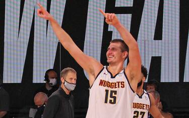 ORLANDO, FL - SEPTEMBER 15: Nikola Jokic #15 of the Denver Nuggets smiles and celebrates as he walks off the court after winning Game Seven of the Western Conference Semifinals against the LA Clippers on September 13, 2020 in Orlando, Florida at AdventHealth Arena. NOTE TO USER: User expressly acknowledges and agrees that, by downloading and/or using this Photograph, user is consenting to the terms and conditions of the Getty Images License Agreement. Mandatory Copyright Notice: Copyright 2020 NBAE (Photo by Madison Quisenberry/NBAE via Getty Images)