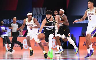 ORLANDO, FL - SEPTEMBER 22: Jamal Murray #27 of the Denver Nuggets drives to the basket against the Los Angeles Lakers during Game Three of the Western Conference Finals of the NBA Playoffs on September 22, 2020 at AdventHealth Arena in Orlando, Florida. NOTE TO USER: User expressly acknowledges and agrees that, by downloading and/or using this Photograph, user is consenting to the terms and conditions of the Getty Images License Agreement. Mandatory Copyright Notice: Copyright 2020 NBAE (Photo by Garrett Ellwood/NBAE via Getty Images)