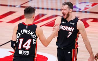 LAKE BUENA VISTA, FLORIDA - SEPTEMBER 23: Tyler Herro #14 of the Miami Heat and Goran Dragic #7 of the Miami Heat react after their win over the Boston Celtics in Game Four of the Eastern Conference Finals during the 2020 NBA Playoffs at AdventHealth Arena at the ESPN Wide World Of Sports Complex on September 23, 2020 in Lake Buena Vista, Florida. NOTE TO USER: User expressly acknowledges and agrees that, by downloading and or using this photograph, User is consenting to the terms and conditions of the Getty Images License Agreement.  (Photo by Kevin C. Cox/Getty Images)