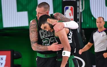 ORLANDO, FL - SEPTEMBER 25: Daniel Theis #27 hugs Jayson Tatum #0 of the Boston Celtics during Game Five of the Eastern Conference Finals of the NBA Playoffs on September 25, 2020 at AdventHealth Arena in Orlando, Florida. NOTE TO USER: User expressly acknowledges and agrees that, by downloading and/or using this Photograph, user is consenting to the terms and conditions of the Getty Images License Agreement. Mandatory Copyright Notice: Copyright 2020 NBAE (Photo by Andrew D. Bernstein/NBAE via Getty Images)