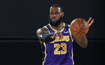 ORLANDO, FL - SEPTEMBER 26: LeBron James #23 of the Los Angeles Lakers passes the ball against the Denver Nuggets during Game Five of the Western Conference Finals on September 26, 2020 in Orlando, Florida at AdventHealth Arena. NOTE TO USER: User expressly acknowledges and agrees that, by downloading and/or using this Photograph, user is consenting to the terms and conditions of the Getty Images License Agreement. Mandatory Copyright Notice: Copyright 2020 NBAE (Photo by Andrew D. Bernstein/NBAE via Getty Images)
