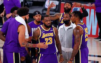 LAKE BUENA VISTA, FLORIDA - SEPTEMBER 26: LeBron James #23 of the Los Angeles Lakers celebrates with teammates after their win against the Denver Nuggets in Game Five of the Western Conference Finals during the 2020 NBA Playoffs at AdventHealth Arena at the ESPN Wide World Of Sports Complex on September 26, 2020 in Lake Buena Vista, Florida. NOTE TO USER: User expressly acknowledges and agrees that, by downloading and or using this photograph, User is consenting to the terms and conditions of the Getty Images License Agreement. (Photo by Kevin C. Cox/Getty Images)