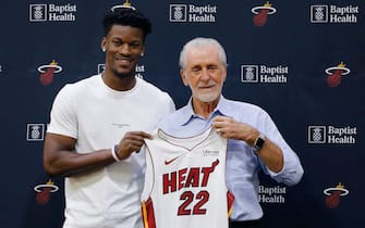 MIAMI, FLORIDA - SEPTEMBER 27:  Jimmy Butler #22 of the Miami Heat poses for a photo with president Pat Riley during his introductory press conference at American Airlines Arena on September 27, 2019 in Miami, Florida. NOTE TO USER: User expressly acknowledges and agrees that, by downloading and or using this photograph, User is consenting to the terms and conditions of the Getty Images License Agreement.  (Photo by Michael Reaves/Getty Images)