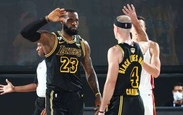 ORLANDO, FL - OCTOBER 2: LeBron James #23 high-fives Alex Caruso #4 of the Los Angeles Lakers during Game Two of the NBA Finals on October 2, 2020 at AdventHealth Arena in Orlando, Florida. NOTE TO USER: User expressly acknowledges and agrees that, by downloading and/or using this Photograph, user is consenting to the terms and conditions of the Getty Images License Agreement. Mandatory Copyright Notice: Copyright 2020 NBAE (Photo by Nathaniel S. Butler/NBAE via Getty Images)