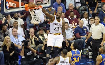 CLEVELAND, OH - JUNE 8:  (Dunk Sequence 3 of 4) LeBron James #23 of the Cleveland Cavaliers dunks the ball against the Golden State Warriors in Game Three of the 2016 NBA Finals on June 8, 2016 at The Quicken Loans Arena in Cleveland, Ohio. NOTE TO USER: User expressly acknowledges and agrees that, by downloading and or using this photograph, user is consenting to the terms and conditions of Getty Images License Agreement. Mandatory Copyright Notice: Copyright 2016 NBAE (Photo by Joe Murphy/NBAE via Getty Images)