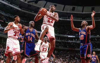 CHICAGO, IL - MARCH 21: John Salley #22 of the Chicago Bulls grabs the rebound against the New York Knicks on March 21, 1996 at the United Center in Chicago, Illinois. NOTE TO USER: User expressly acknowledges and agrees that, by downloading and/or using this photograph, user is consenting to the terms and conditions of the Getty Images License Agreement. Mandatory Copyright Notice: Copyright 1996 NBAE (Photo by Ron Modra/NBAE via Getty Images)