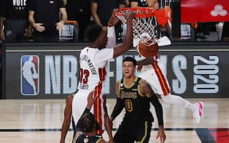 LAKE BUENA VISTA, FLORIDA - OCTOBER 09: Bam Adebayo #13 of the Miami Heat dunks the ball against Kyle Kuzma #0 of the Los Angeles Lakers during the second quarter in Game Five of the 2020 NBA Finals at AdventHealth Arena at the ESPN Wide World Of Sports Complex on October 9, 2020 in Lake Buena Vista, Florida. NOTE TO USER: User expressly acknowledges and agrees that, by downloading and or using this photograph, User is consenting to the terms and conditions of the Getty Images License Agreement. (Photo by Sam Greenwood/Getty Images)