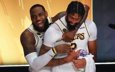 LAKE BUENA VISTA, FLORIDA - OCTOBER 11: LeBron James #23 of the Los Angeles Lakers and Anthony Davis #3 of the Los Angeles Lakers react after winning the 2020 NBA Championship in Game Six of the 2020 NBA Finals at AdventHealth Arena at the ESPN Wide World Of Sports Complex on October 11, 2020 in Lake Buena Vista, Florida. NOTE TO USER: User expressly acknowledges and agrees that, by downloading and or using this photograph, User is consenting to the terms and conditions of the Getty Images License Agreement.  (Photo by Mike Ehrmann/Getty Images)