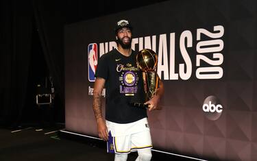 ORLANDO, FL - OCTOBER 11: Anthony Davis #3 of the Los Angeles Lakers walks off the court with the Larry O'Brien Championship Trophy after winning Game Six of the NBA Finals on October 11, 2020 at AdventHealth Arena in Orlando, Florida. NOTE TO USER: User expressly acknowledges and agrees that, by downloading and/or using this Photograph, user is consenting to the terms and conditions of the Getty Images License Agreement. Mandatory Copyright Notice: Copyright 2020 NBAE (Photo by Nathaniel S. Butler/NBAE via Getty Images)